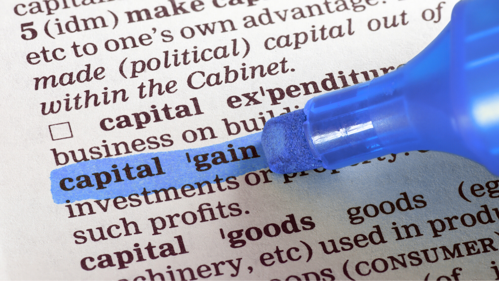 Capital gains tax documentation with blue highlighter pen