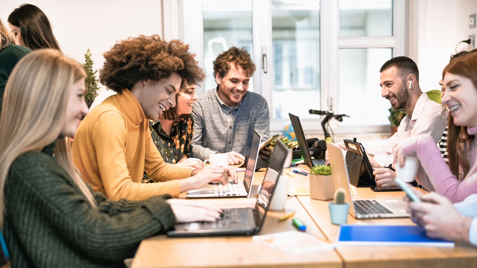 WeWork coworking space with people collaborating